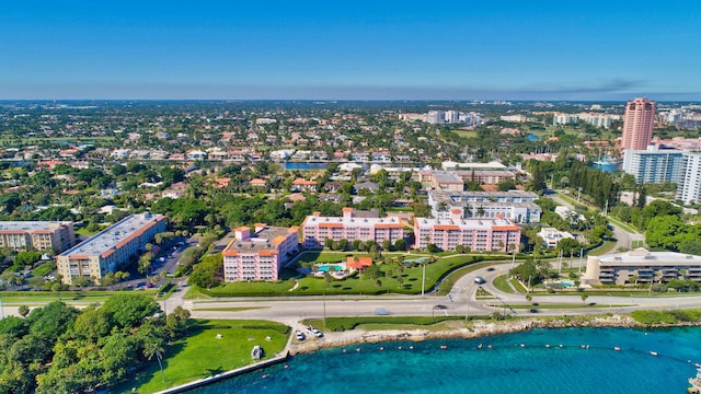 birds eye view of property with a view of city and a water view