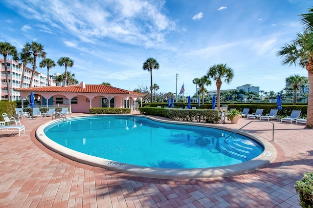 community pool featuring a patio area