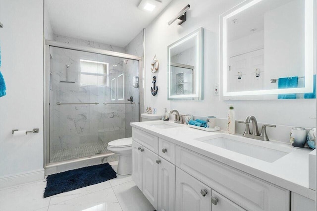 full bathroom featuring a sink, a marble finish shower, toilet, and double vanity