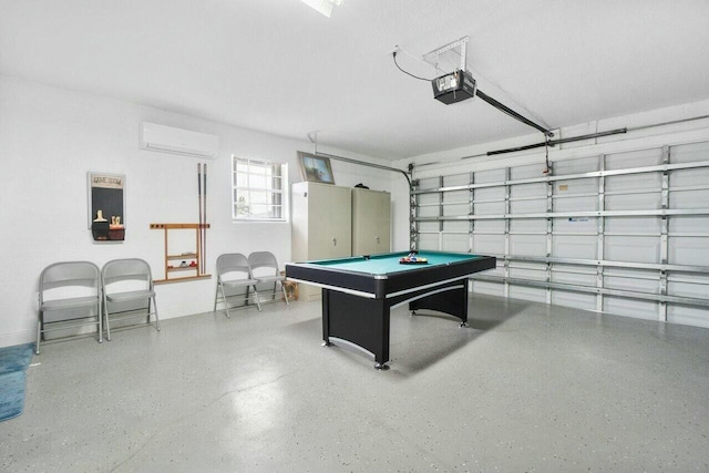 rec room featuring billiards, speckled floor, baseboards, an AC wall unit, and a garage