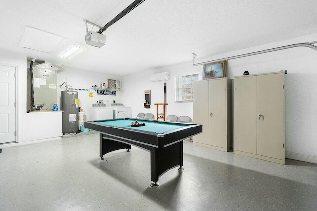 rec room featuring water heater, a garage, heating unit, independent washer and dryer, and light speckled floor