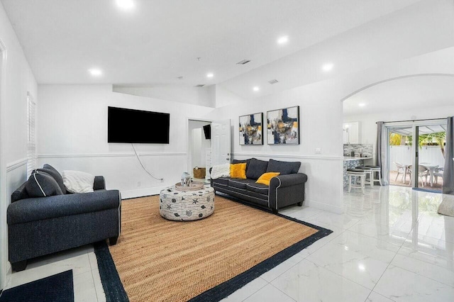 living room featuring visible vents, marble finish floor, recessed lighting, arched walkways, and lofted ceiling