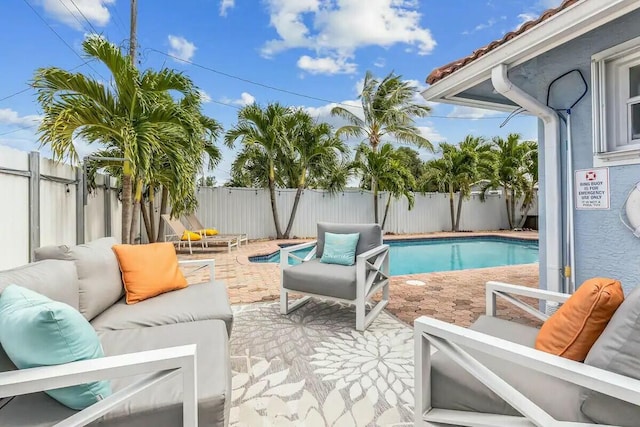 view of swimming pool featuring an outdoor hangout area, a fenced backyard, and a patio area