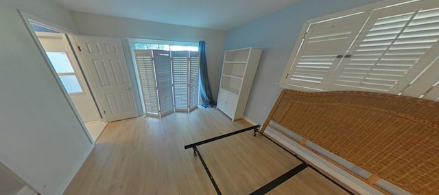 entrance foyer with baseboards and wood finished floors