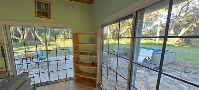 doorway to outside with wood finished floors