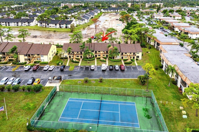 birds eye view of property with a residential view