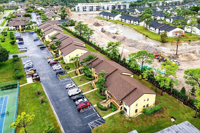 birds eye view of property featuring a residential view and a water view