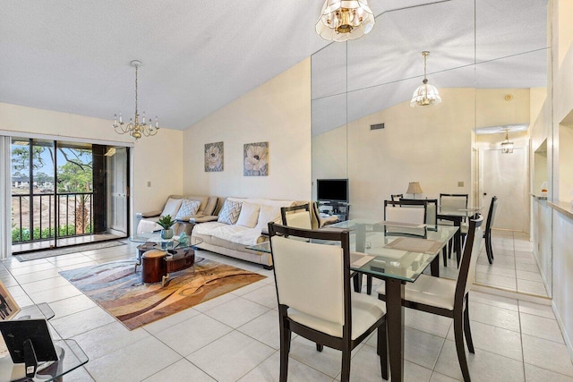 dining area with light tile patterned floors, a notable chandelier, high vaulted ceiling, and a textured ceiling