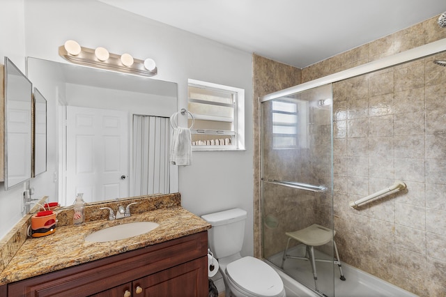 full bath featuring a shower stall, toilet, and vanity