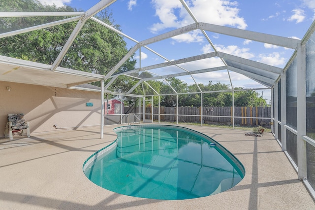 view of pool with a lanai, a fenced in pool, a patio, and a fenced backyard