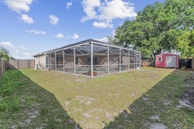 view of yard featuring a storage unit, an outdoor structure, a fenced backyard, and a patio area