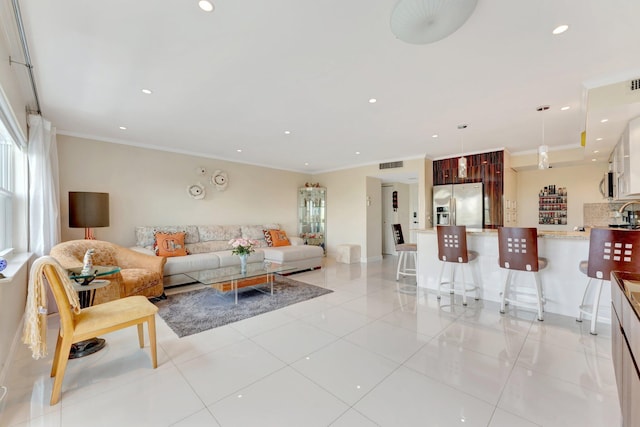 living room with recessed lighting, light tile patterned flooring, and crown molding