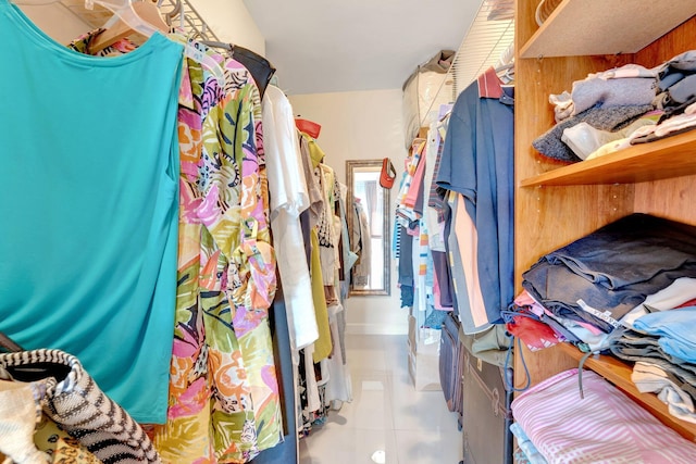 spacious closet with tile patterned floors