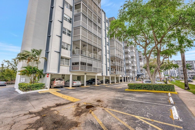 view of property featuring uncovered parking