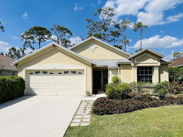 ranch-style house featuring stucco siding, a garage, and driveway