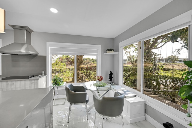 dining space with recessed lighting, baseboards, and marble finish floor