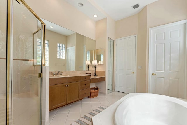 bathroom featuring vanity, a tub to relax in, visible vents, a shower stall, and tile patterned floors