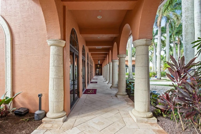 view of exterior entry featuring stucco siding