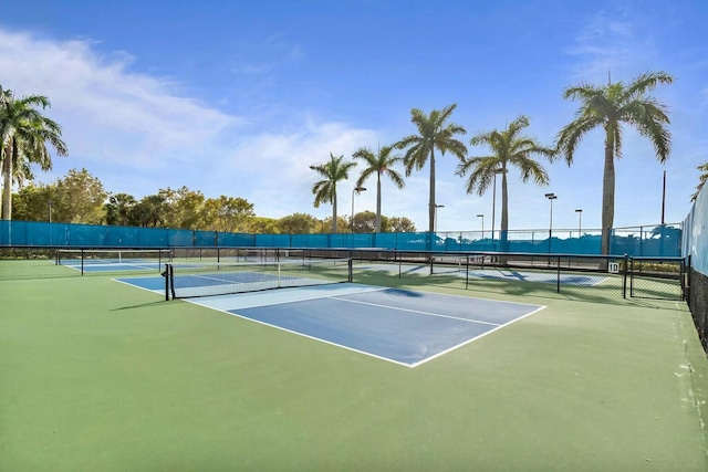 view of sport court with fence