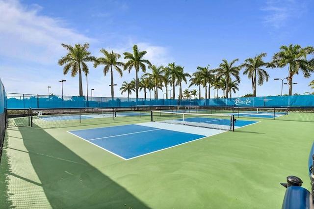 view of sport court featuring fence