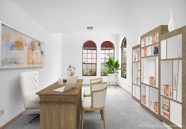 carpeted dining space featuring baseboards and visible vents