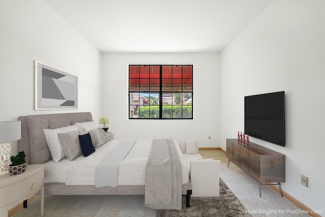 bedroom featuring baseboards and carpet flooring