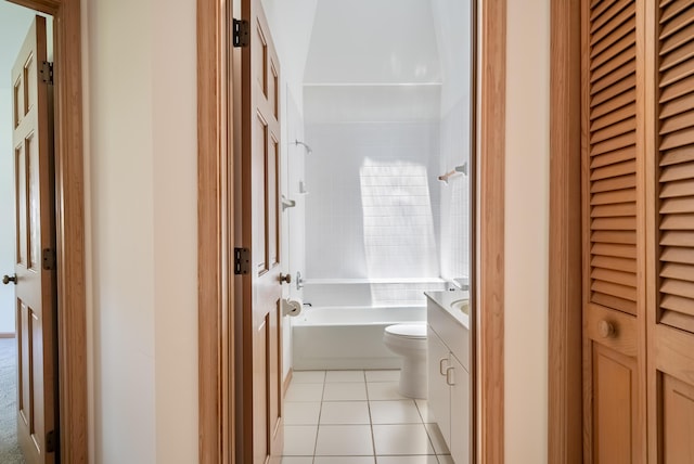 full bath featuring tile patterned flooring, shower / washtub combination, toilet, a closet, and vanity