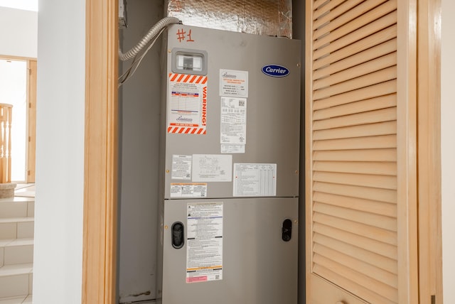 utility room with heating unit