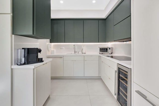 kitchen with beverage cooler, light countertops, light tile patterned floors, black electric cooktop, and dishwasher