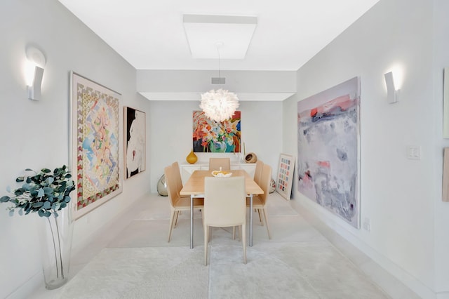 dining room featuring a notable chandelier and visible vents