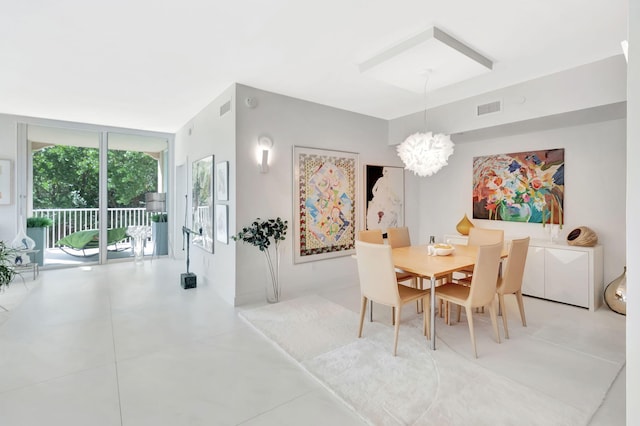 dining room with visible vents, light tile patterned flooring, a chandelier, and floor to ceiling windows