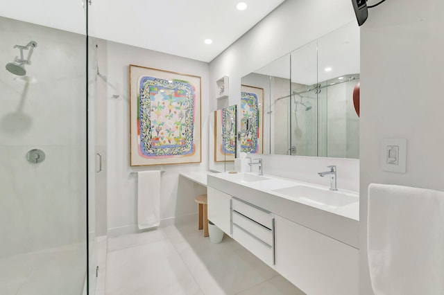 full bathroom with double vanity, recessed lighting, a stall shower, and a sink