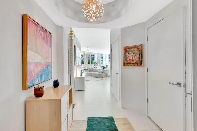 hall featuring light tile patterned flooring