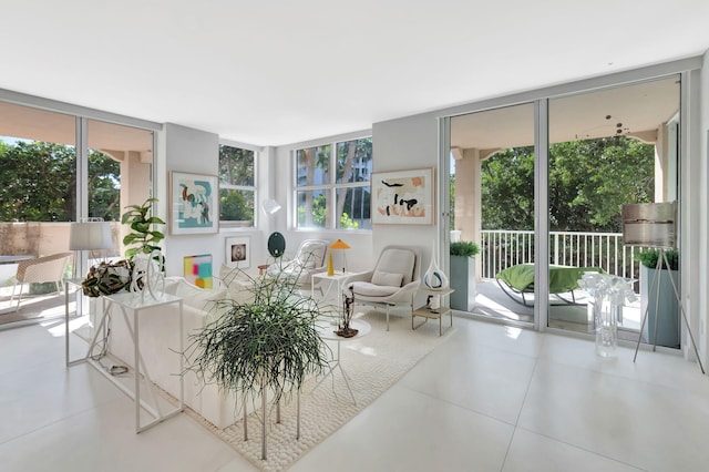 living area with tile patterned floors and expansive windows