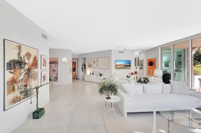 living room with visible vents and expansive windows