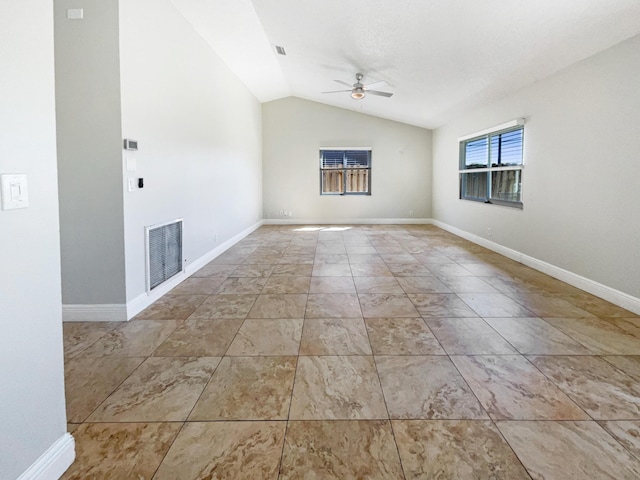 empty room featuring visible vents, baseboards, lofted ceiling, and a ceiling fan