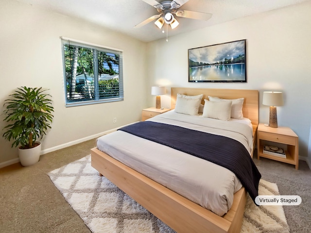 carpeted bedroom featuring a ceiling fan and baseboards