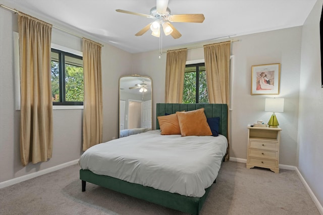 bedroom featuring a ceiling fan, baseboards, and carpet floors