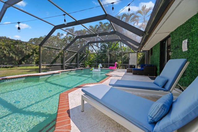 pool featuring a patio, a lanai, and outdoor lounge area