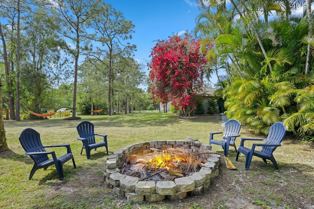 view of yard featuring an outdoor fire pit