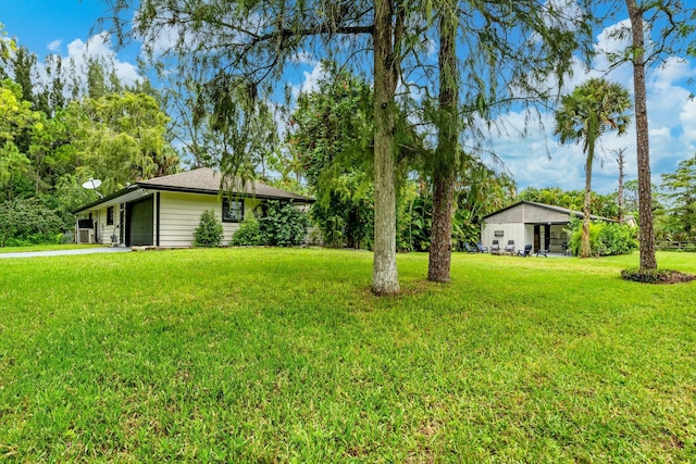 view of yard with a garage