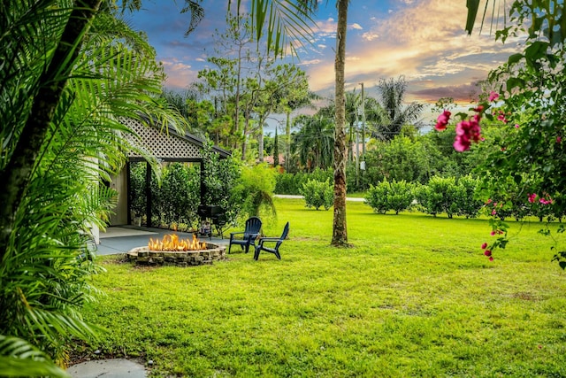 view of yard featuring a gazebo and an outdoor fire pit