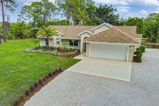 ranch-style home featuring concrete driveway, a front yard, roof with shingles, stucco siding, and a garage