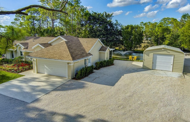 17393 84th Ct N, Loxahatchee, FL 33470 - view of front of house featuring a shingled roof, stucco siding, concrete driveway, and view of wooded area