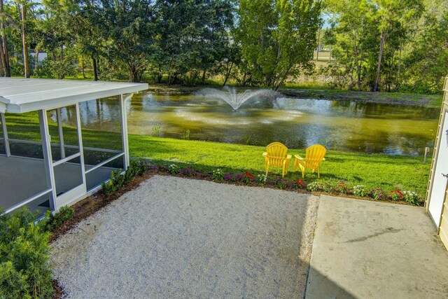 17393 84th Ct N, Loxahatchee, FL 33470 - view of patio / terrace with a water view