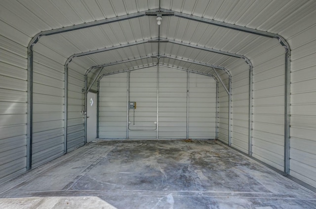 garage with a detached carport