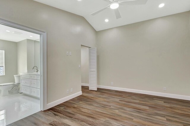 17393 84th Ct N, Loxahatchee, FL 33470 - unfurnished room with a ceiling fan, wood finished floors, vaulted ceiling, baseboards, and recessed lighting