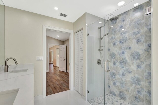 17393 84th Ct N, Loxahatchee, FL 33470 - full bathroom with a stall shower, recessed lighting, double vanity, wood finished floors, and baseboards