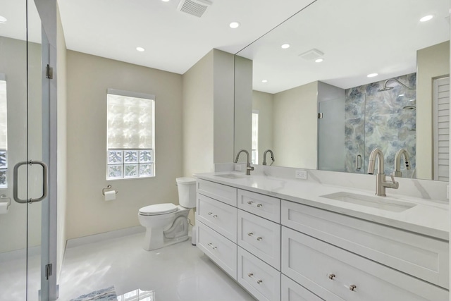 bathroom with a sink, visible vents, and a stall shower