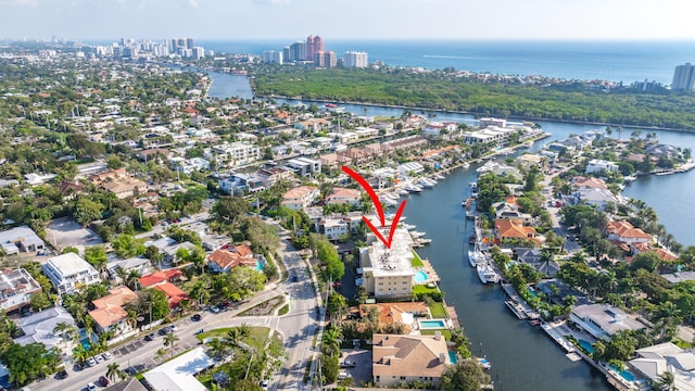 birds eye view of property featuring a water view